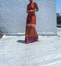 Load image into Gallery viewer, Vintage Mod Print Halter Maxi Dress. SIZE: Not listed, best fits M Measures approximately: 16.5" pit to pit / 14.5" empire waist/ 16" waist / 22" hip / 55.5" length (Measurements taken laying flat, double where applicable) MODEL: 5'1, 119lbs, size 4 COMPOSITION: Not listed We kindly remind you vintage items have been pre-loved, therefore, they may show signs of wear. Any major flaws will be noted. Feel free to email us with any questions before purchasing.
