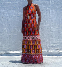 Load image into Gallery viewer, Vintage Mod Print Halter Maxi Dress. SIZE: Not listed, best fits M Measures approximately: 16.5" pit to pit / 14.5" empire waist/ 16" waist / 22" hip / 55.5" length (Measurements taken laying flat, double where applicable) MODEL: 5'1, 119lbs, size 4 COMPOSITION: Not listed We kindly remind you vintage items have been pre-loved, therefore, they may show signs of wear. Any major flaws will be noted. Feel free to email us with any questions before purchasing.
