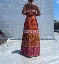 Load image into Gallery viewer, Vintage Mod Print Halter Maxi Dress. SIZE: Not listed, best fits M Measures approximately: 16.5" pit to pit / 14.5" empire waist/ 16" waist / 22" hip / 55.5" length (Measurements taken laying flat, double where applicable) MODEL: 5'1, 119lbs, size 4 COMPOSITION: Not listed We kindly remind you vintage items have been pre-loved, therefore, they may show signs of wear. Any major flaws will be noted. Feel free to email us with any questions before purchasing.