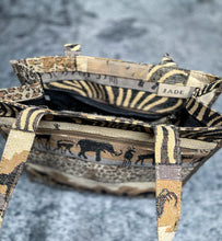 Load image into Gallery viewer, Animal print bag with mini coin purse. In like-new condition. 5.5" W / 12" H / 12" L