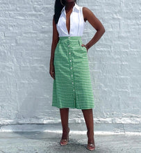 Load image into Gallery viewer, Vintage 60s/70s Gingham A line Button Up Skirt By Saks Fifth Avenue. Pinned to fit.   SIZE: Not listed    Measures approximately: 27&quot; waist / 21.5&quot; hip / 28&quot; length   MODEL: 5&#39;1, 119lbs, size 4  COMPOSITION: Not listed
