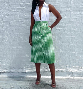 Vintage 60s/70s Gingham A line Button Up Skirt By Saks Fifth Avenue. Pinned to fit.   SIZE: Not listed    Measures approximately: 27" waist / 21.5" hip / 28" length   MODEL: 5'1, 119lbs, size 4  COMPOSITION: Not listed