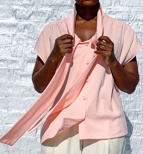 Baby pink pussy bow button-up blouse.