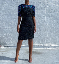 Load image into Gallery viewer, Beautiful Vintage Silk Sequin Dress By Stenay.   SIZE: 12     Measures approximately: 20&quot; pit to pit / 16&quot; waist / 20&quot; hips / 37&quot; length   (Measurements taken flat, double where applicable)   MODEL: 5&#39;1, 119lbs, size 4  COMPOSITION: 100% Silk, Polyester lined
