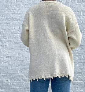The sweetest floral knit Sweater with a cut-out hemline.   SIZE: Not listed, best fits S/M   