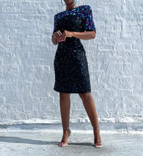 Load image into Gallery viewer, Beautiful Vintage Silk Sequin Dress By Stenay.   SIZE: 12     Measures approximately: 20&quot; pit to pit / 16&quot; waist / 20&quot; hips / 37&quot; length   (Measurements taken flat, double where applicable)   MODEL: 5&#39;1, 119lbs, size 4  COMPOSITION: 100% Silk, Polyester lined
