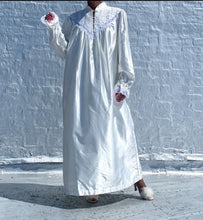 Load image into Gallery viewer, White Victorian Style Cotton/ Poly robe with pearl buttons and lace details By Character.   **Missing one button, tiny run-in fabric on the arm. See the last photo.   SIZE: L    Measures approximately: 24&quot; pit to pit / 29&quot; wide / 51&quot; length 

